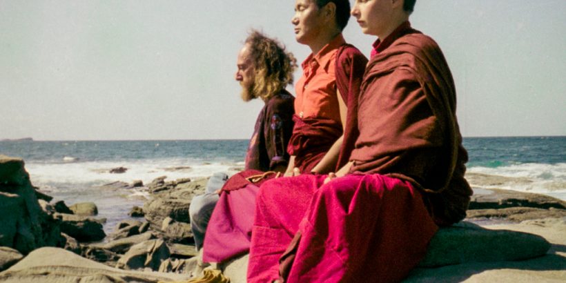 (15851_ng.tif) Lama Yeshe with Yeshe Khadro and Chamba Lane meditating by the ocean, Maroochydore, Australia, 1974. The lamas took a day off during the Diamond Valley course to go to the beach in Tom Vichta's van. Everyone got out to enjoy the view from the cliffs, but Lama Yeshe ran straight down to the water's edge, hitched up his robes, and waded in, splashing about with delight.