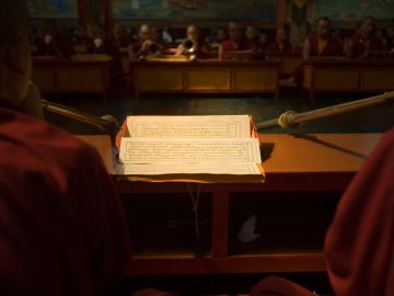 Buddhist monks reading and chanting sutras at the Vajra Vidya Institute for Buddhist studies in Sarnath, India